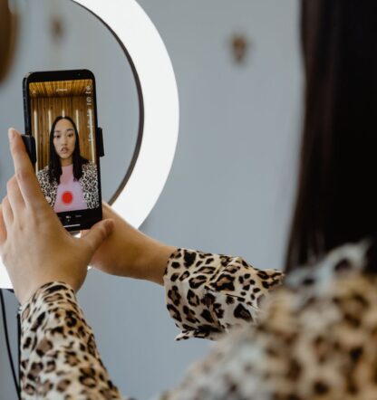 Woman filming video content on iphone